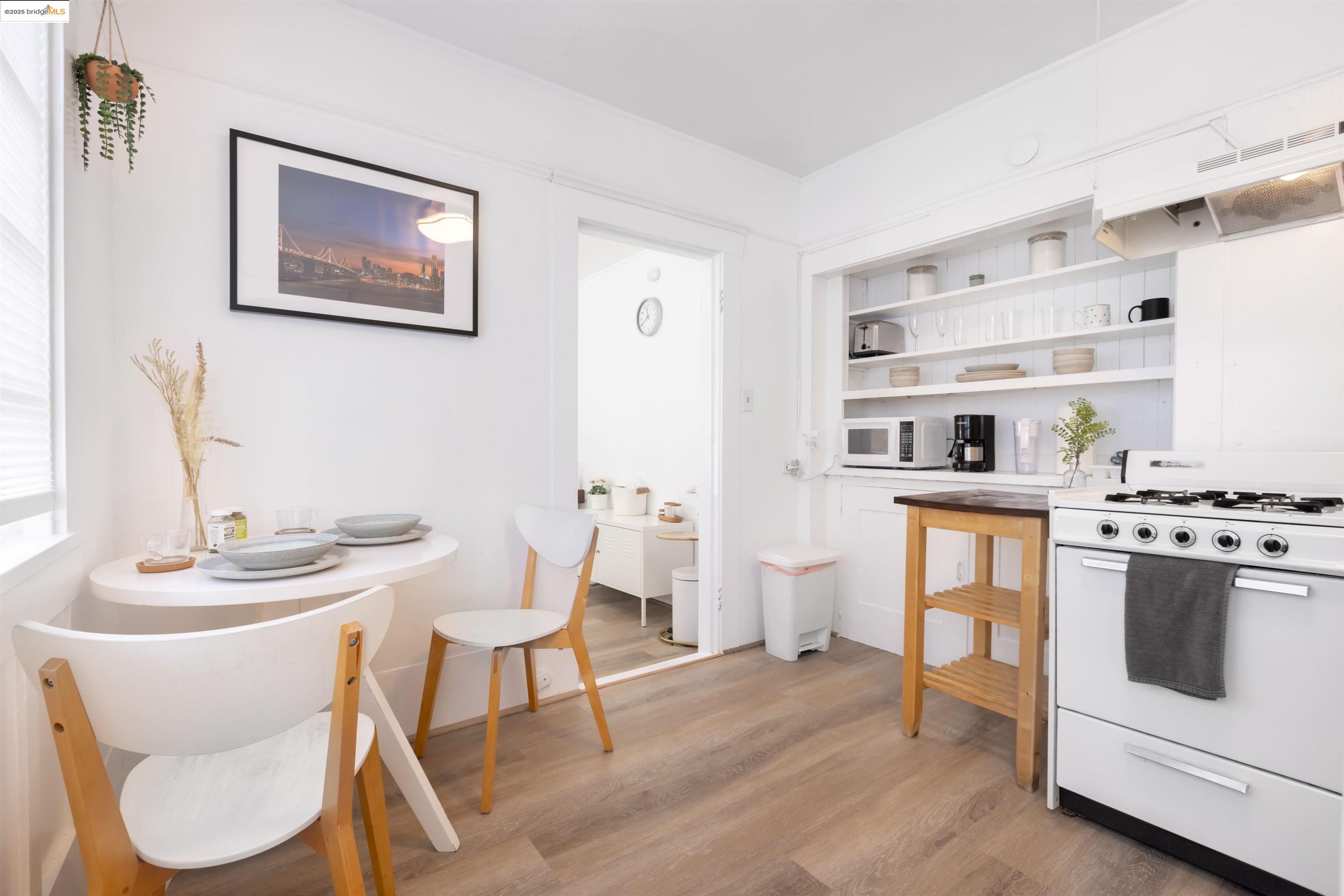 400 Lagunitas Avenue Oakland, CA 94610 - Photo 5 of 14 a dining room with furniture and wooden floor