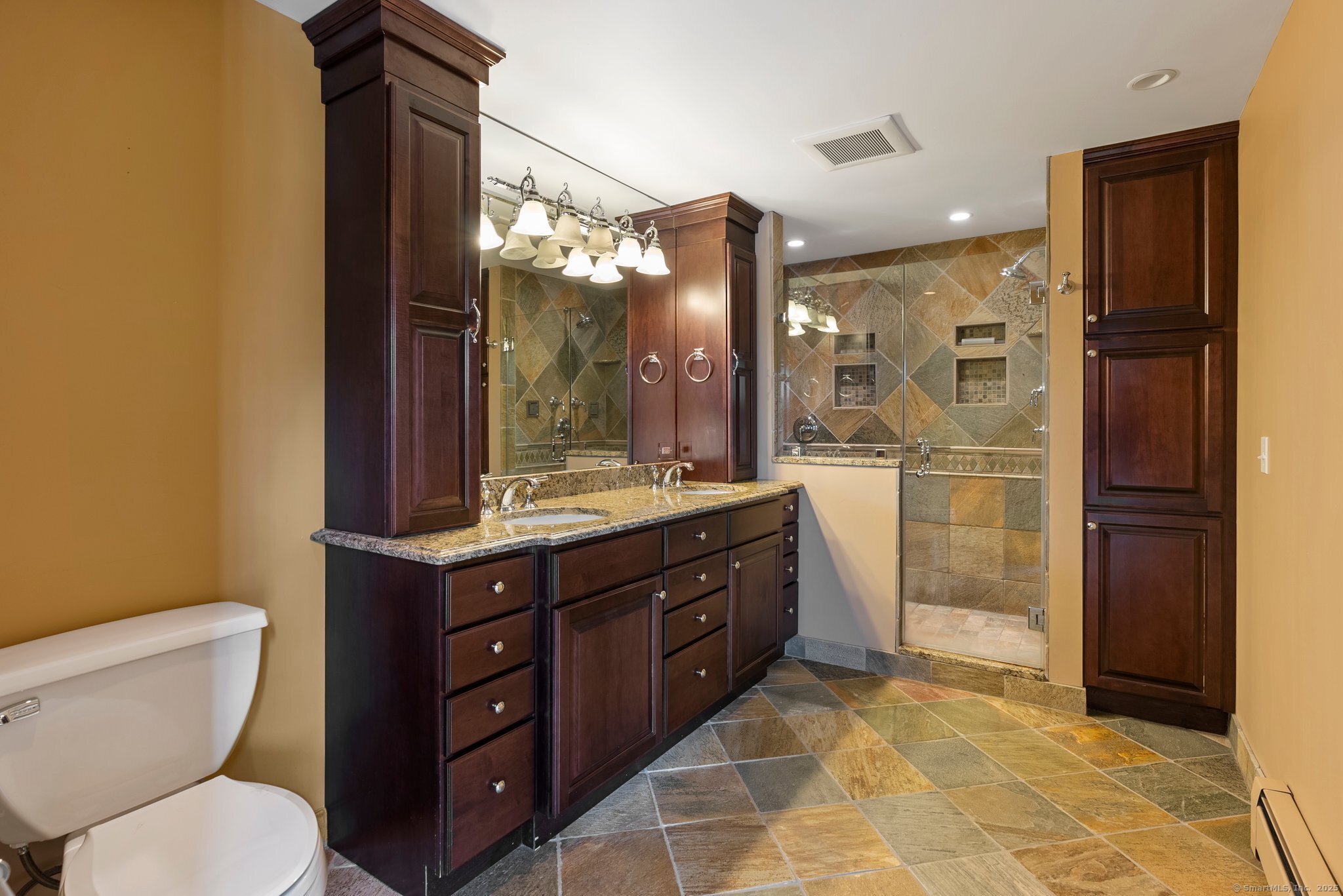 104 Willow Street Wethersfield, CT 06109 - Photo 13 of 28 a bathroom with a double vanity sink toilet and shower