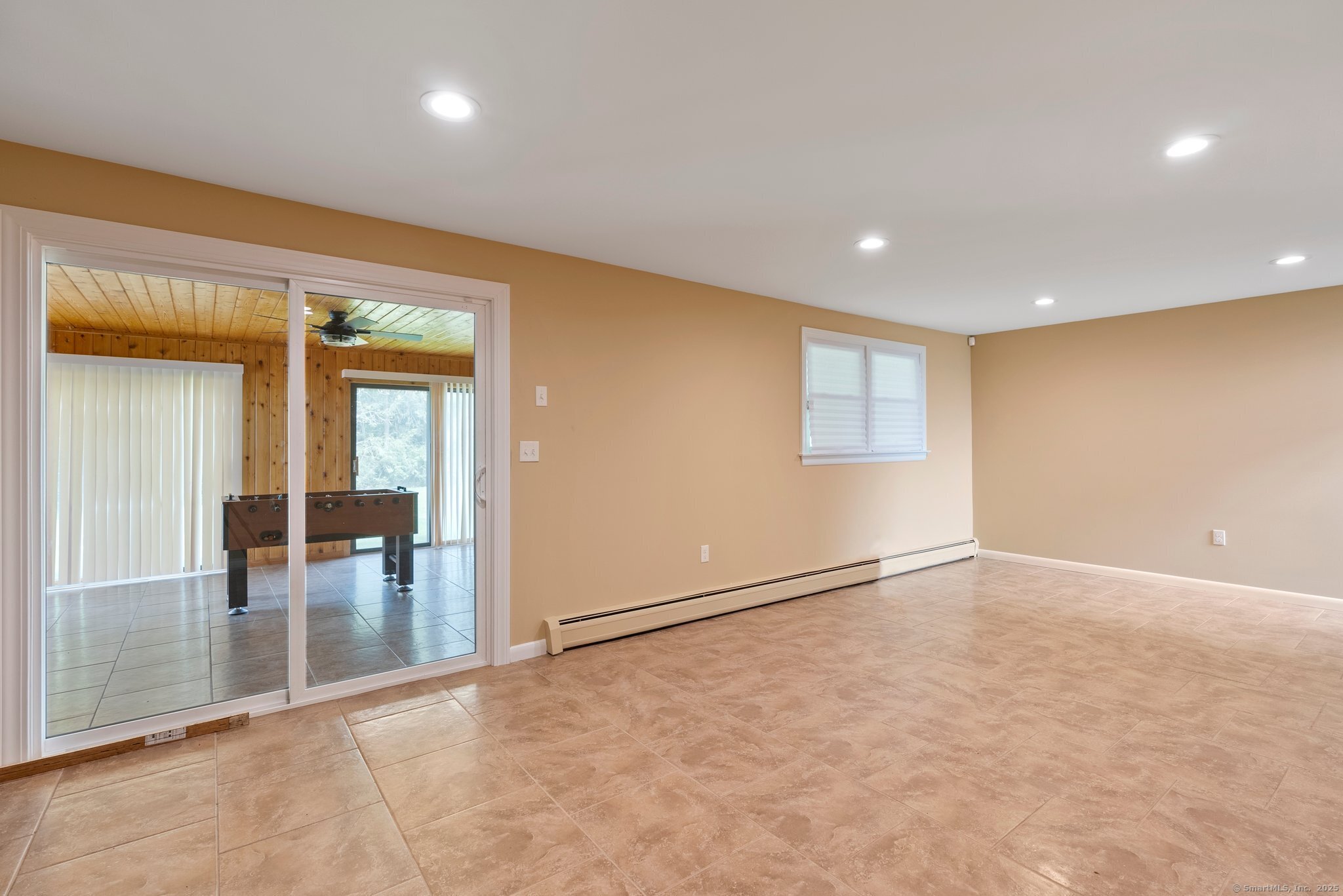 104 Willow Street Wethersfield, CT 06109 - Photo 23 of 28 wooden floor in an empty room with a window