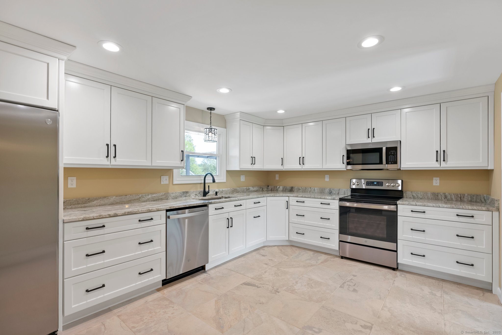 104 Willow Street Wethersfield, CT 06109 - Photo 7 of 28 a kitchen with granite countertop white cabinets and stainless steel appliances