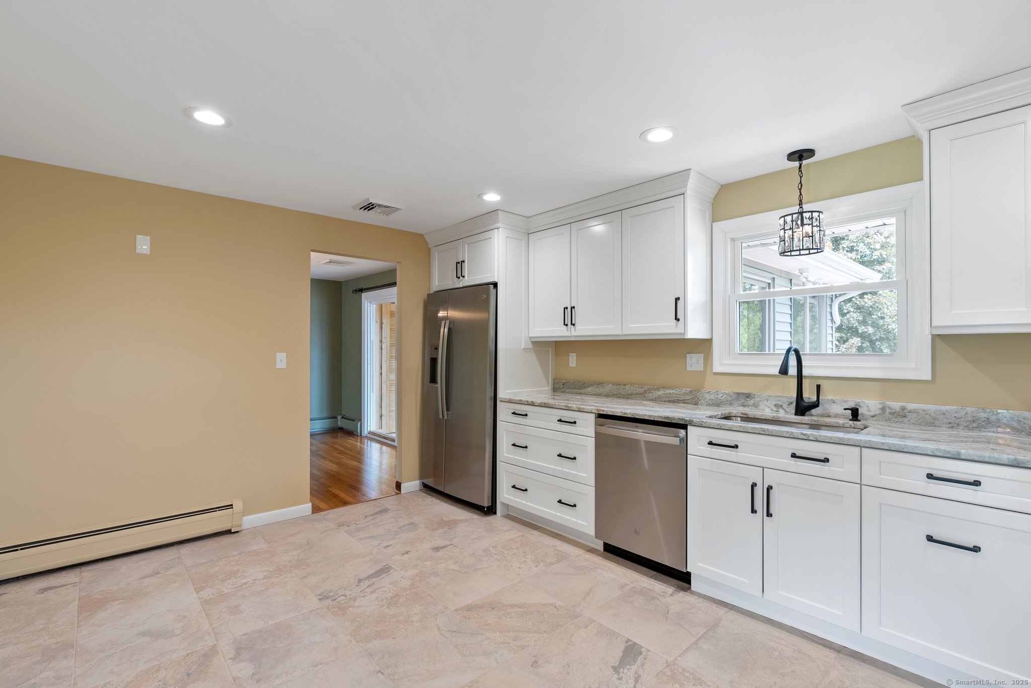 104 Willow Street Wethersfield, CT 06109 - Photo 8 of 28 a kitchen with a sink stove and refrigerator