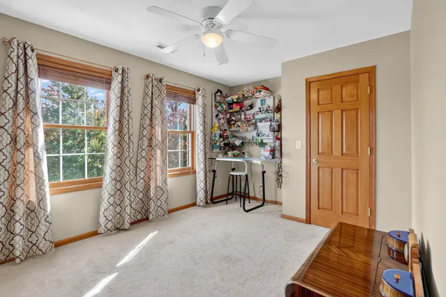 a view of a livingroom with furniture and a window