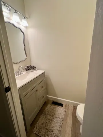 a bathroom with a sink a vanity and a mirror