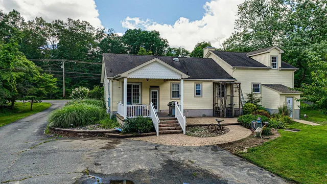 a front view of a house with garden