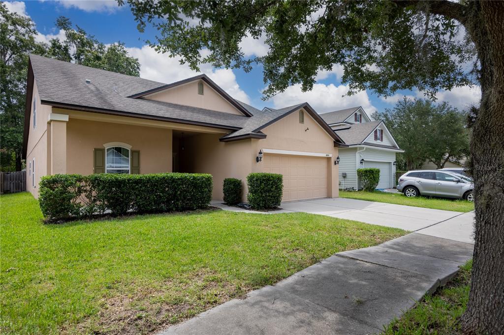 8216 Northwest 54th Street Gainesville, FL 32653 - Photo 4 of 58 a front view of a house with a yard and garage