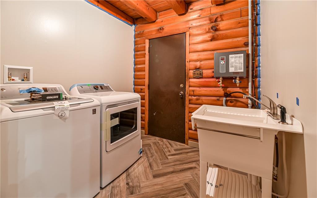 288 Myoma Road Mars, PA 16046 - Photo 22 of 25 Laundry Room with new washing machine and dryer. Instantaneous hot water heater is on the wall. The door leads to the front 2 car garage.