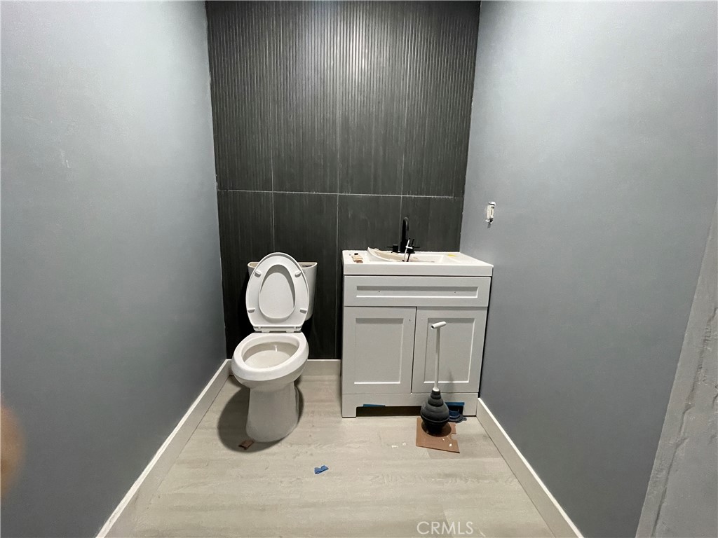 1212 West Commonwealth Avenue Fullerton, CA 92833 - Photo 12 of 14 a bathroom with a toilet sink and vanity