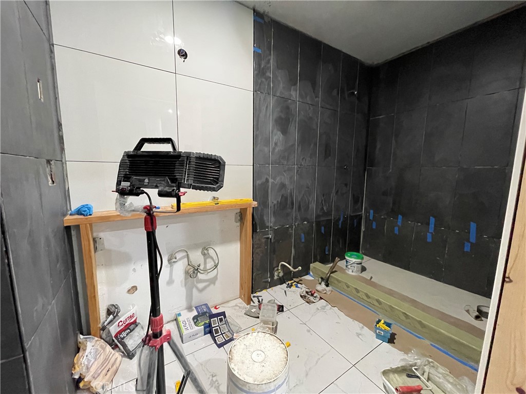 1212 West Commonwealth Avenue Fullerton, CA 92833 - Photo 13 of 14 a bed room with a bed a couch and dresser