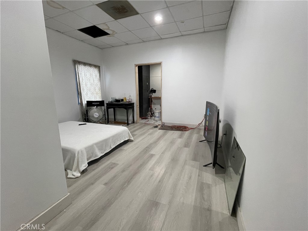 1212 West Commonwealth Avenue Fullerton, CA 92833 - Photo 7 of 14 a living room with furniture and a wooden floor