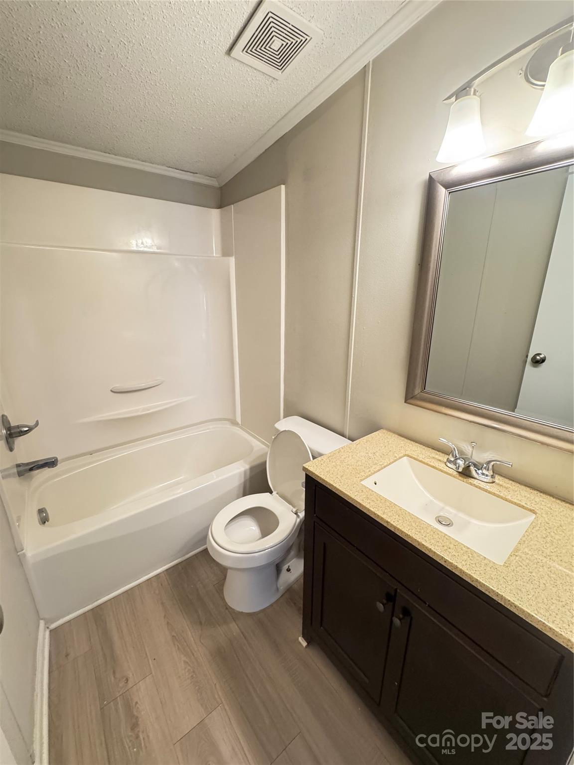 406 West Mill Street Landis, NC 28088 - Photo 19 of 20 a bathroom with a sink a toilet a mirror and bathtub