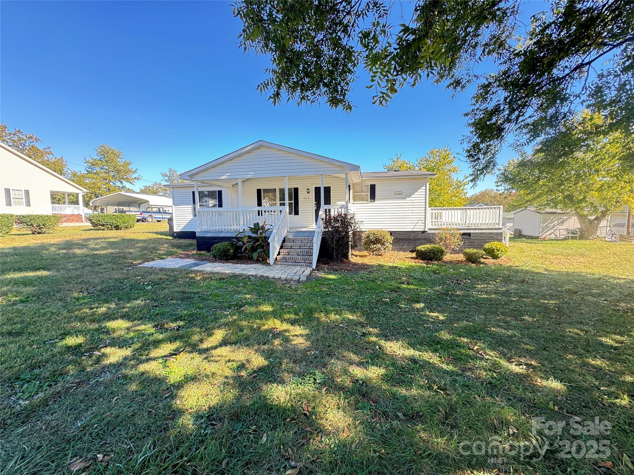 406 West Mill Street Landis, NC 28088 - Photo 2 of 20 a front view of a house with a yard