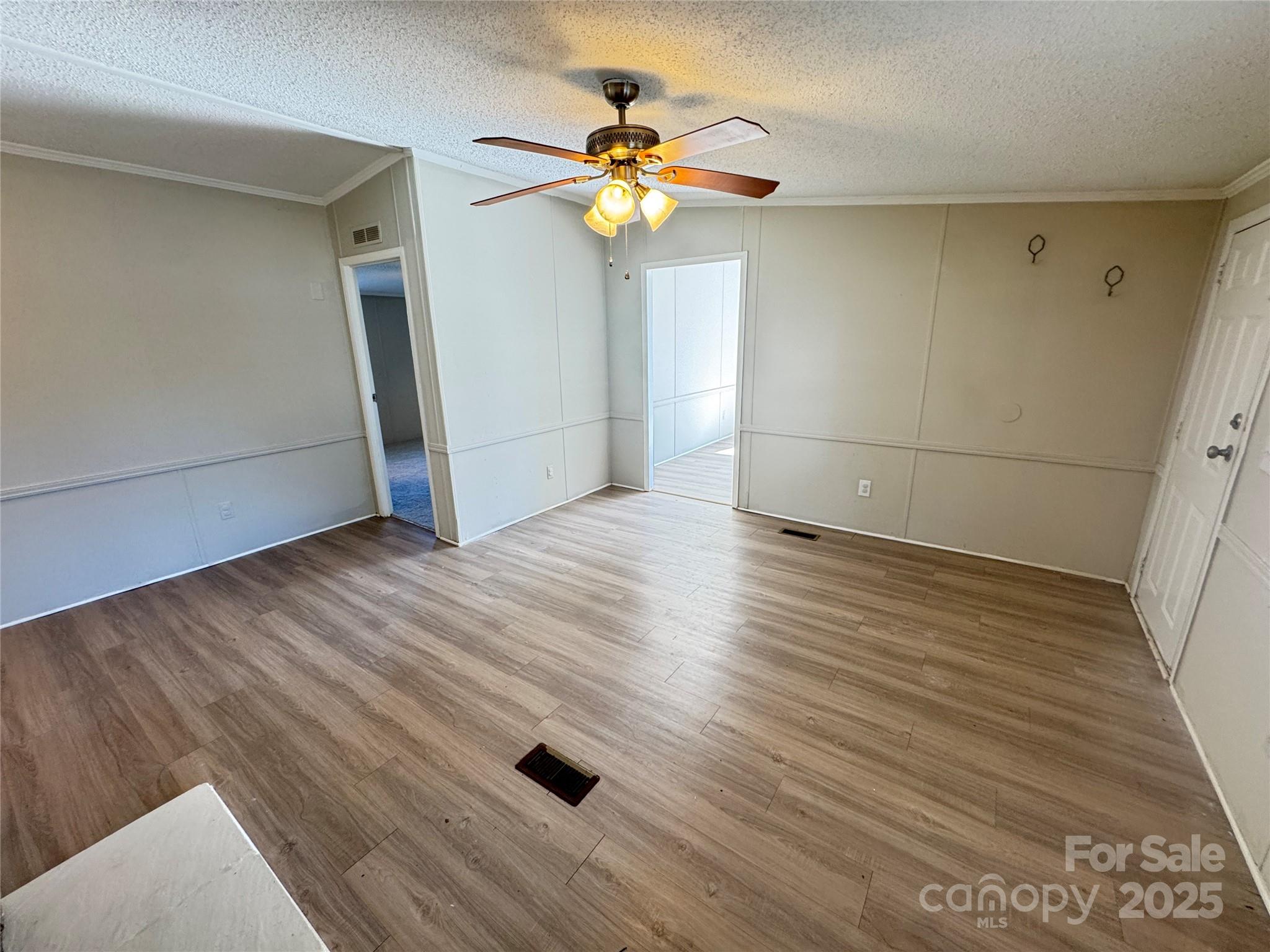 406 West Mill Street Landis, NC 28088 - Photo 6 of 20 wooden floor in an empty room with a window