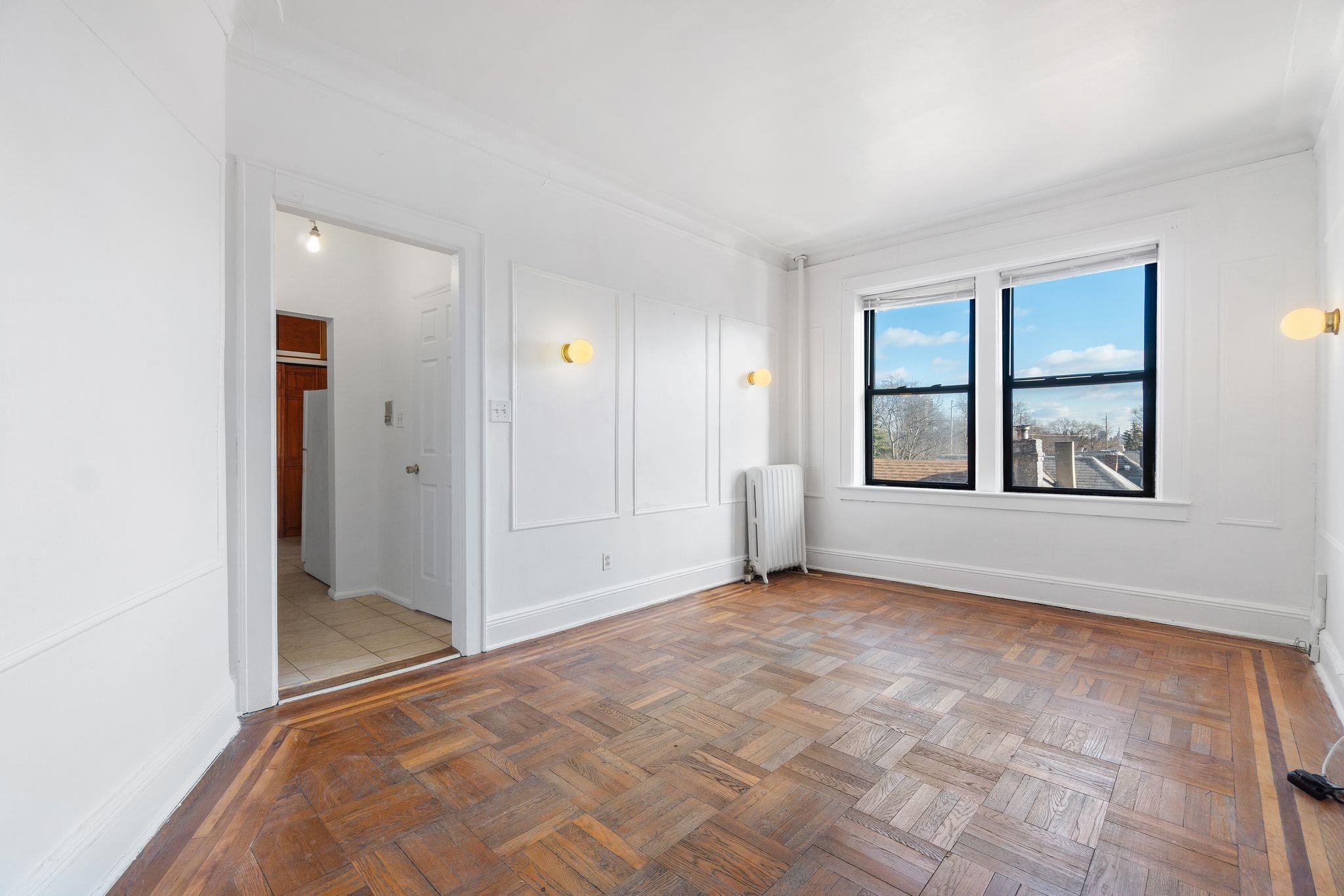 435 79th Street, Unit 47 North Bergen, NJ 07047 - Photo 2 of 20 an empty room with windows and closet