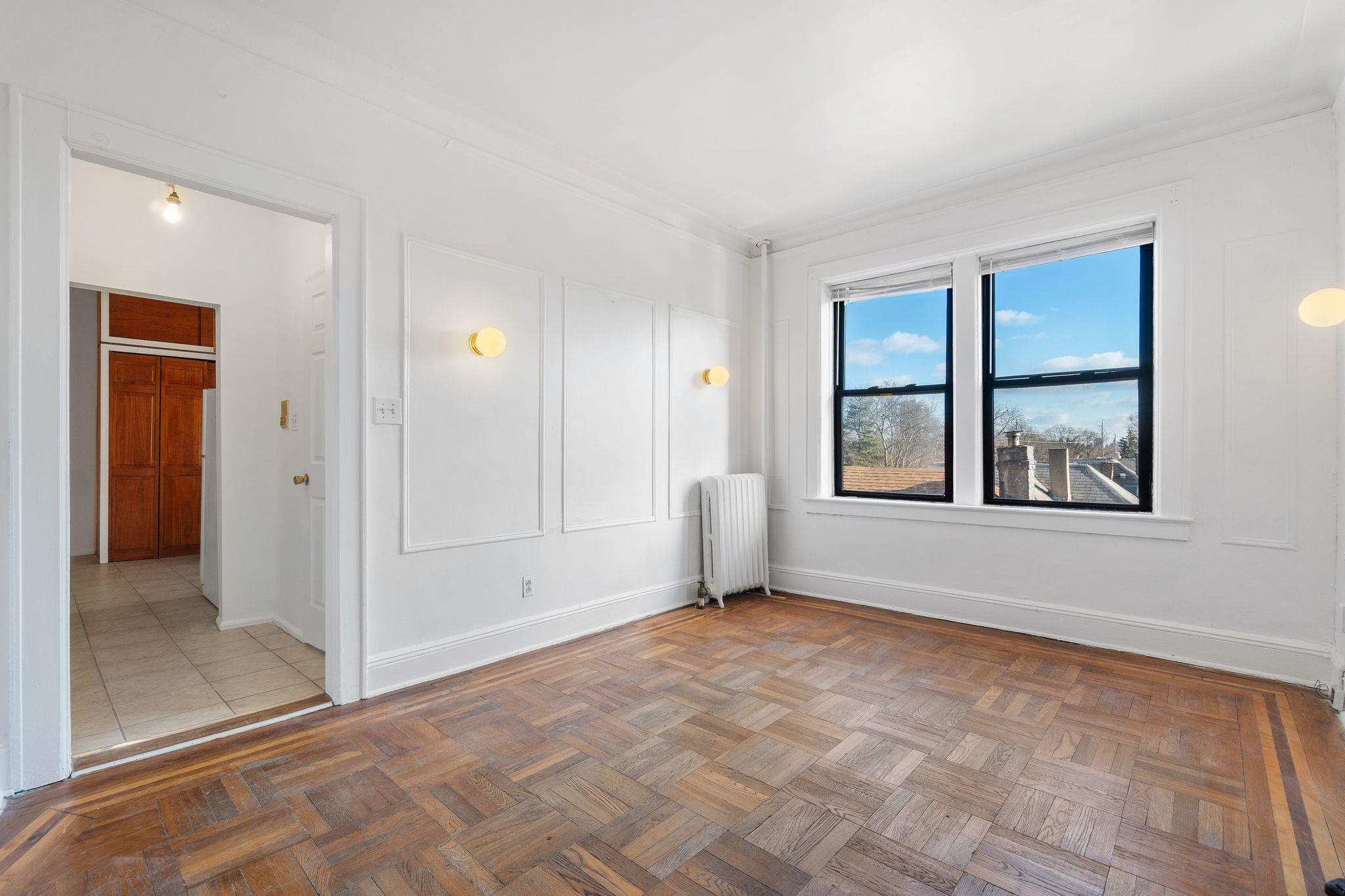 435 79th Street, Unit 47 North Bergen, NJ 07047 - Photo 3 of 20 a view of an empty room with window and bathroom