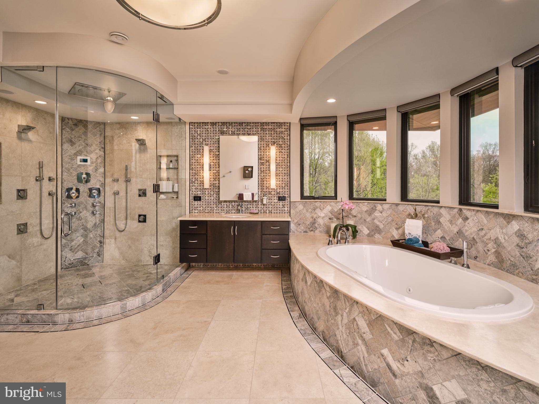 48 Street Road New Hope, PA 18938 - Photo 40 of 119 a spacious bathroom with a double vanity sink a mirror and a bathtub