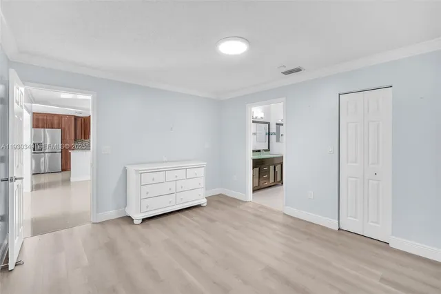 wooden floor with an empty room and fire place