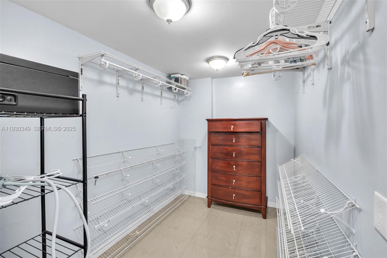 8300 Northwest 201st Street Hialeah, FL 33015 - Photo 21 of 33 a view of walk in closet