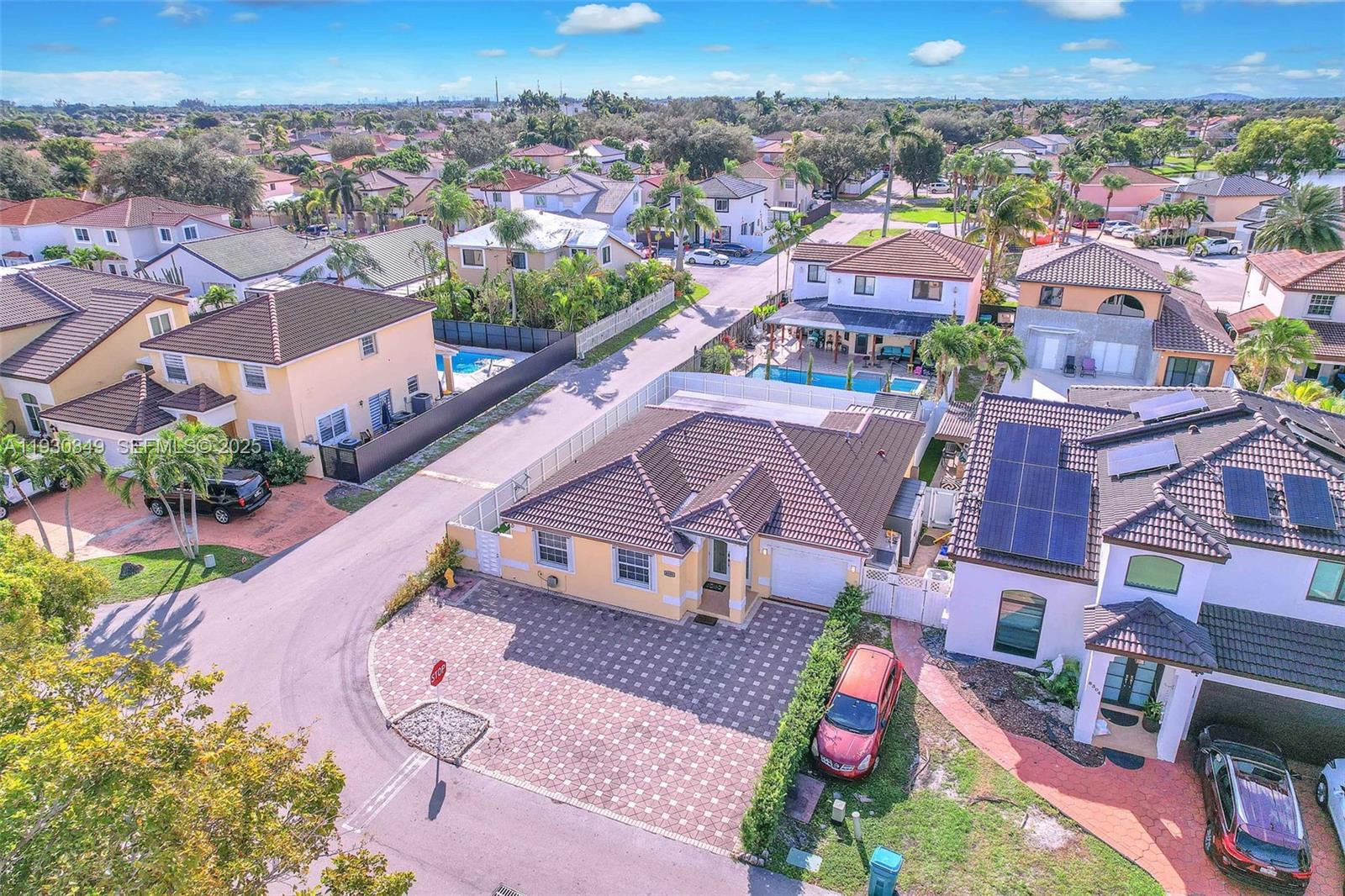 8300 Northwest 201st Street Hialeah, FL 33015 - Photo 26 of 33 an aerial view of residential houses with outdoor space and parking