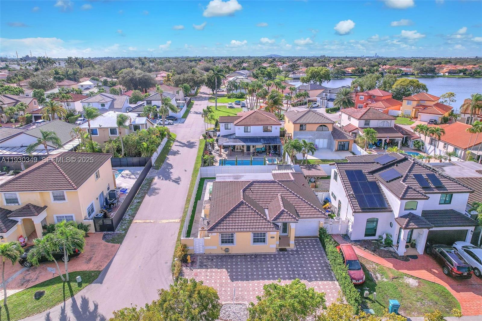 8300 Northwest 201st Street Hialeah, FL 33015 - Photo 27 of 33 an aerial view of residential houses with outdoor space and parking