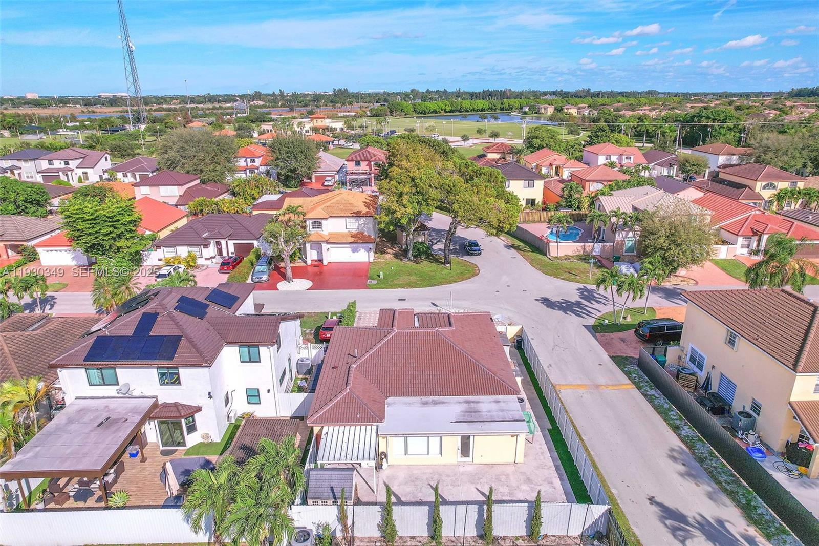 8300 Northwest 201st Street Hialeah, FL 33015 - Photo 29 of 33 an aerial view of residential houses with outdoor space