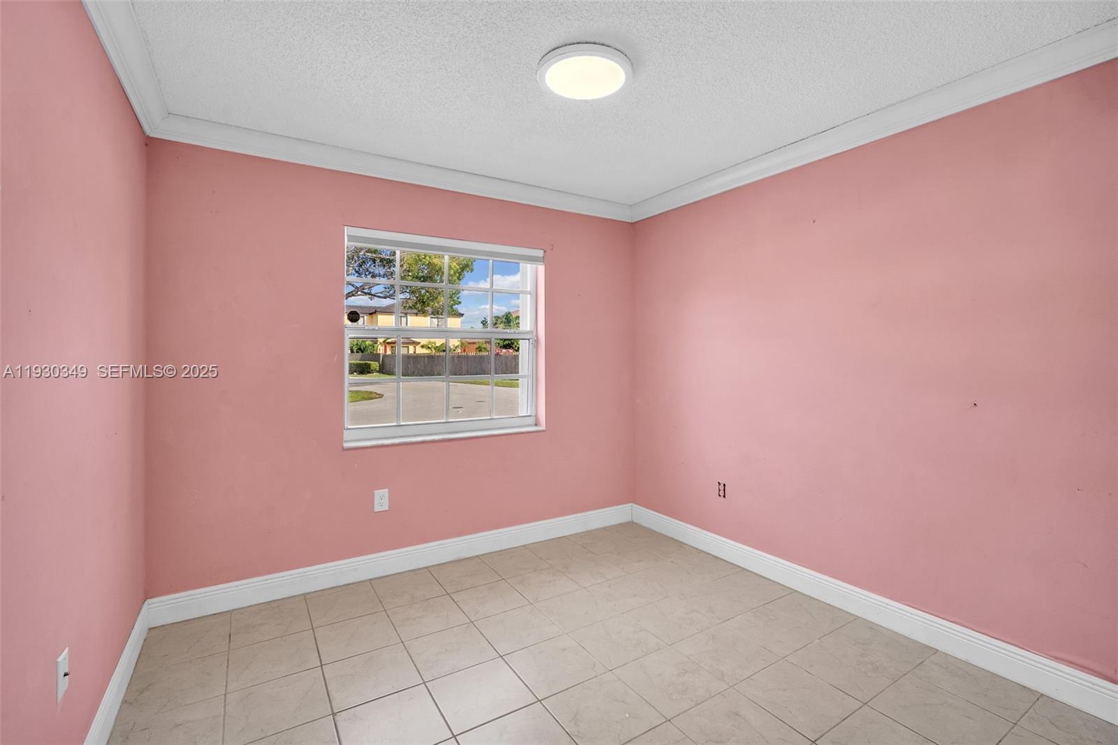 8300 Northwest 201st Street Hialeah, FL 33015 - Photo 8 of 33 an empty room with windows