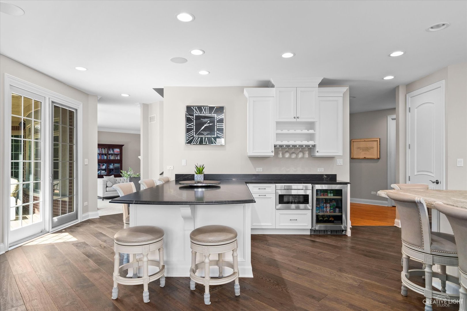 521 Chatfield Road New Lenox, IL 60451 - Photo 19 of 48 a kitchen with stainless steel appliances granite countertop a stove top oven a sink a dining table and chairs
