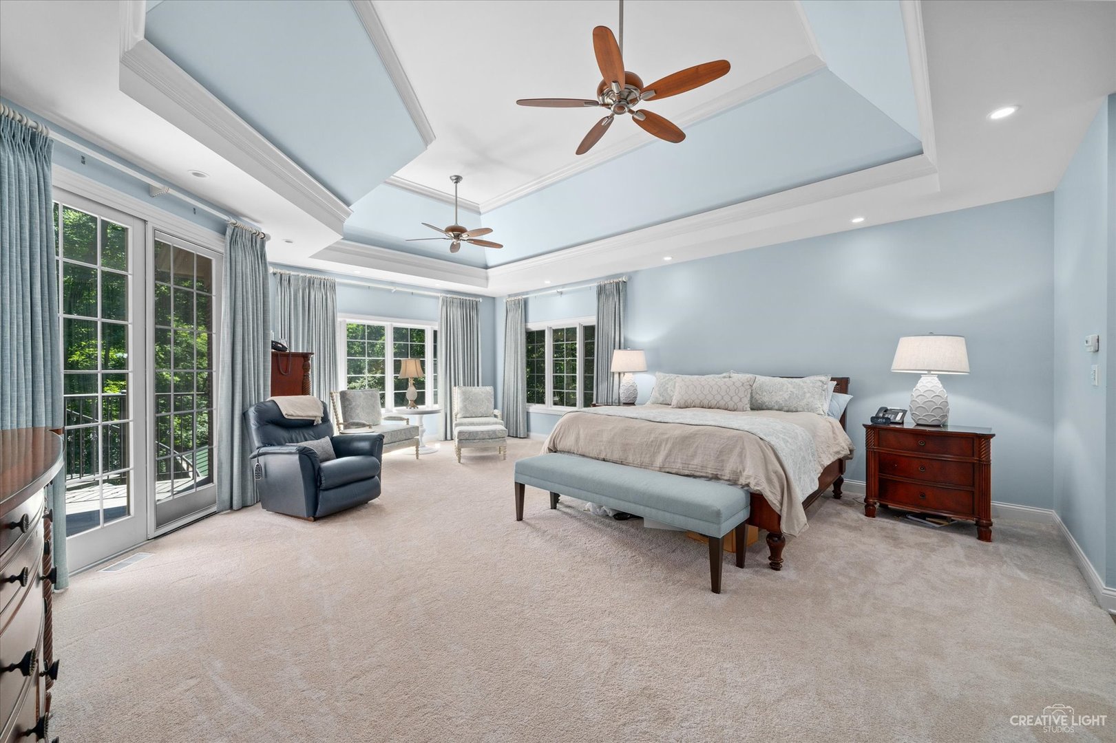 521 Chatfield Road New Lenox, IL 60451 - Photo 26 of 48 a spacious bedroom with a bed couch and a large window