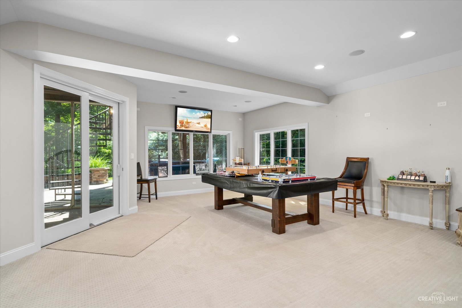 521 Chatfield Road New Lenox, IL 60451 - Photo 39 of 48 a living room with furniture and a potted plant next to a large window