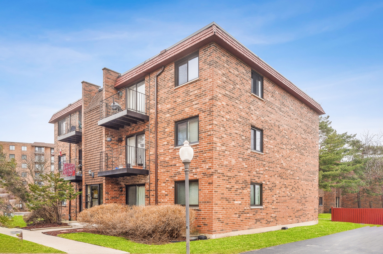 1779 West Algonquin Road, Unit 1A Mount Prospect, IL 60056 - Photo 1 of 15 a front view of a house with garden