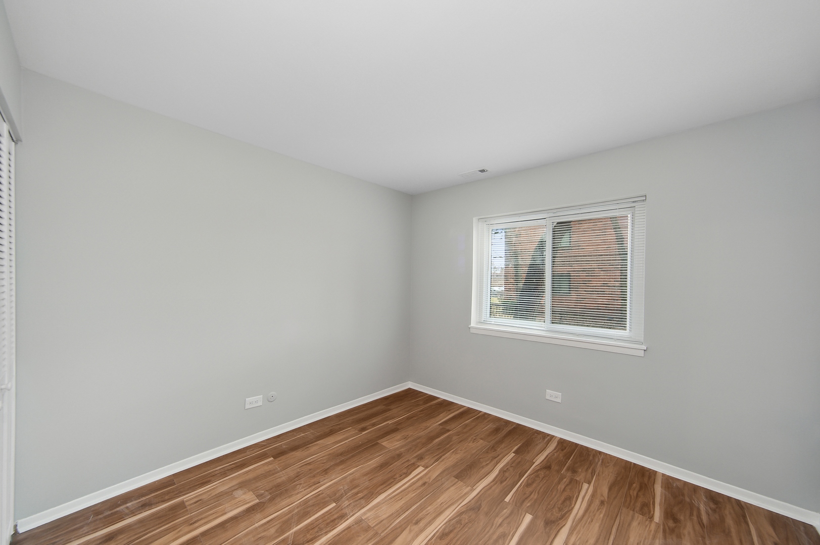 1779 West Algonquin Road, Unit 1A Mount Prospect, IL 60056 - Photo 10 of 15 an empty room with a window