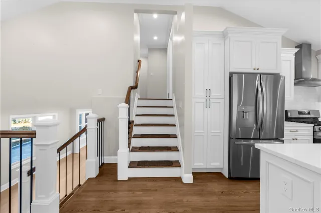 an empty room with closet and a hallway