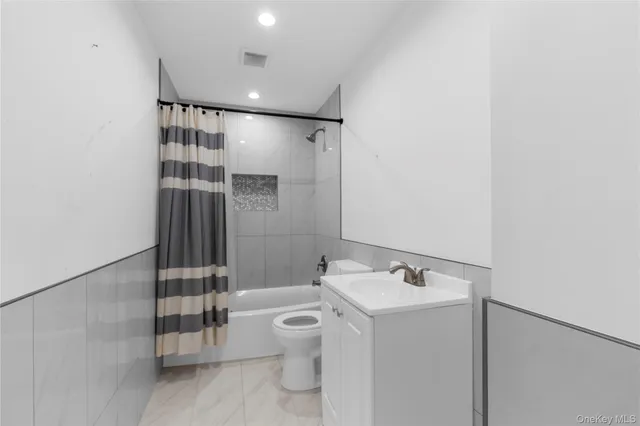 a bathroom with a toilet and a sink