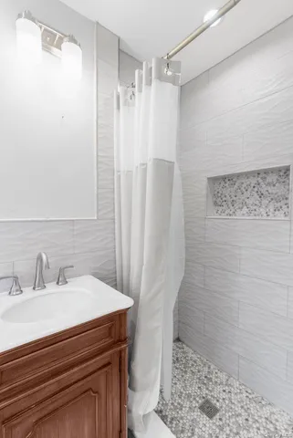 a view of a pathway both side of the house