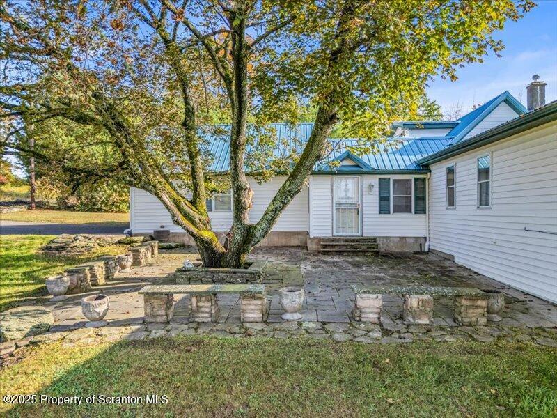 3886 Bow Bridge Road Friendsville, PA 18818 - Photo 14 of 71 a backyard of a house with lots of green space