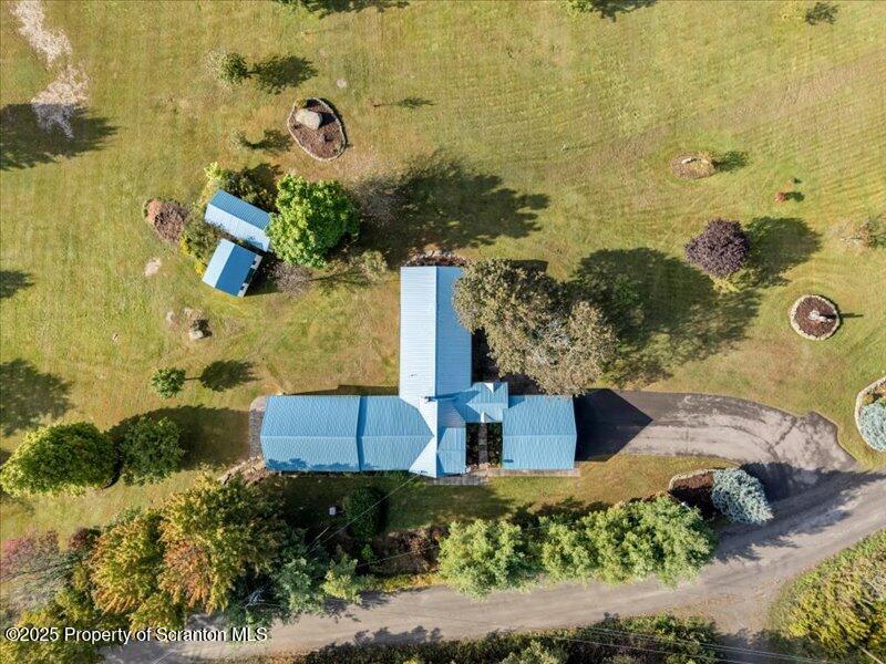 3886 Bow Bridge Road Friendsville, PA 18818 - Photo 16 of 71 an aerial view of a house with a yard