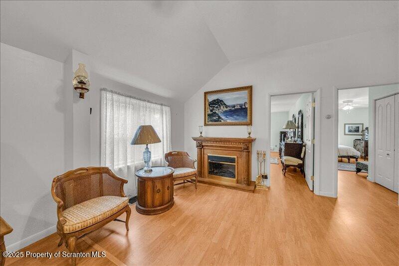 3886 Bow Bridge Road Friendsville, PA 18818 - Photo 31 of 71 a living room with furniture and a fireplace
