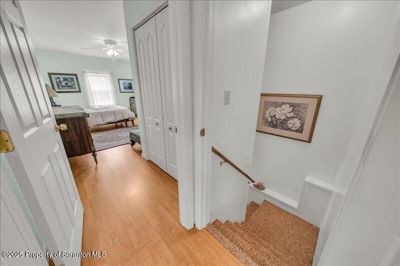 3886 Bow Bridge Road Friendsville, PA 18818 - Photo 40 of 71 a view of a hallway with furniture and wooden floor