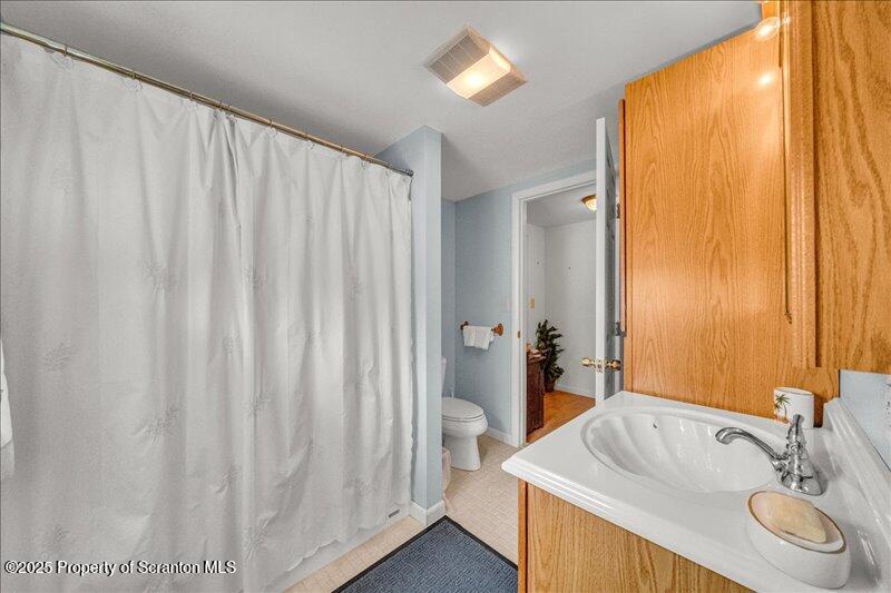 3886 Bow Bridge Road Friendsville, PA 18818 - Photo 48 of 71 a bathroom with a tub and sink