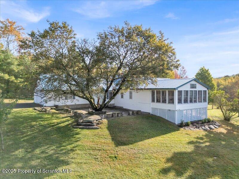 3886 Bow Bridge Road Friendsville, PA 18818 - Photo 5 of 71 a view of a house with a yard