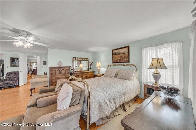 3886 Bow Bridge Road Friendsville, PA 18818 - Photo 50 of 71 a bed room with a bed and a couch