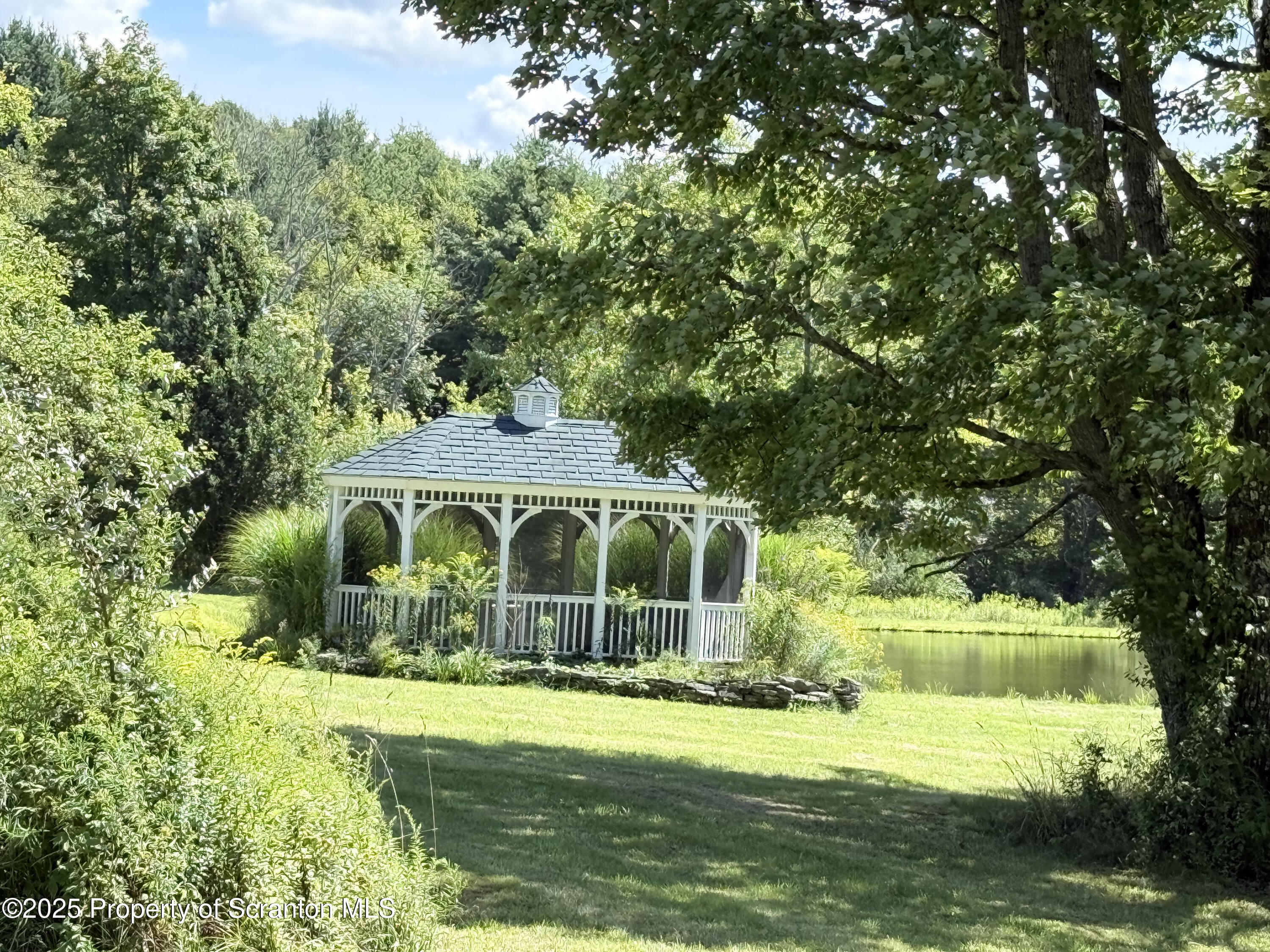 3886 Bow Bridge Road Friendsville, PA 18818 - Photo 61 of 71 a front view of a house with a yard