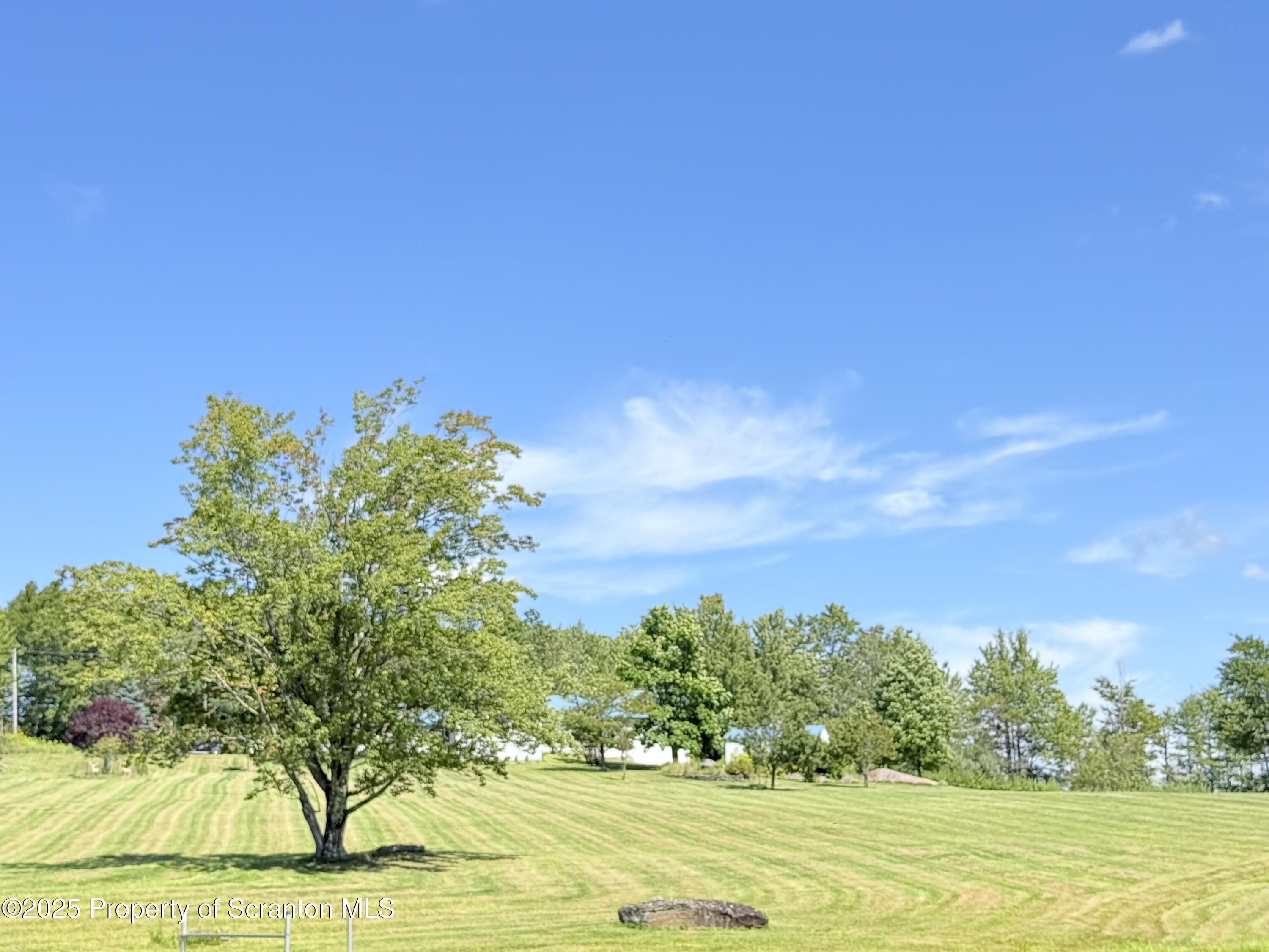 3886 Bow Bridge Road Friendsville, PA 18818 - Photo 70 of 71 a view of a yard with an outdoor space and seating