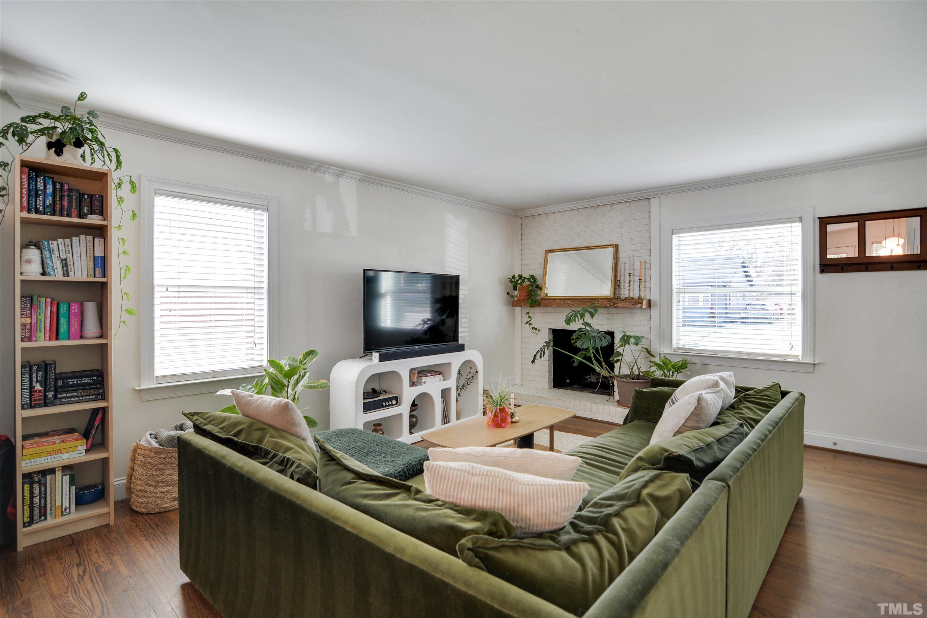 821 Coleman Street Raleigh, NC 27610 - Photo 3 of 22 a living room with furniture and a flat screen tv