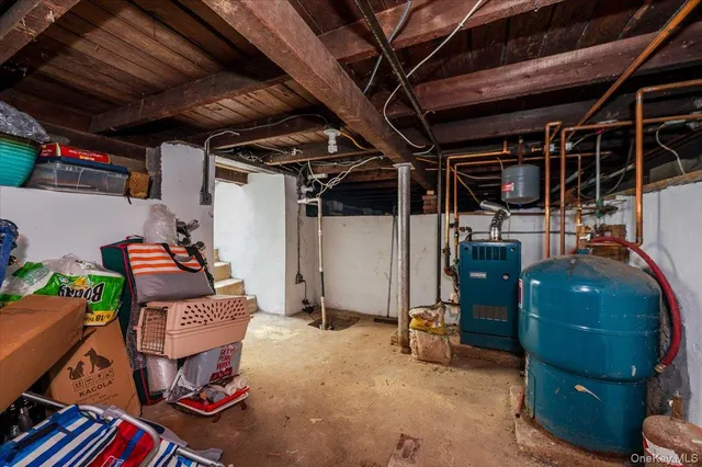a view of a house with a yard and potted plants
