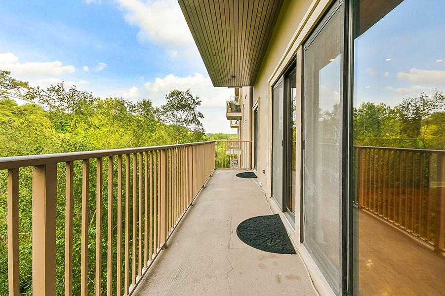 2865 Lenox Road Northeast, Unit 407 Atlanta, GA 30324 - Photo 7 of 27 a view of balcony and wooden floor