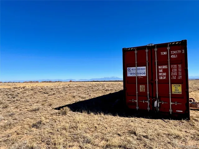 a view of wooden floor and a wooden fence