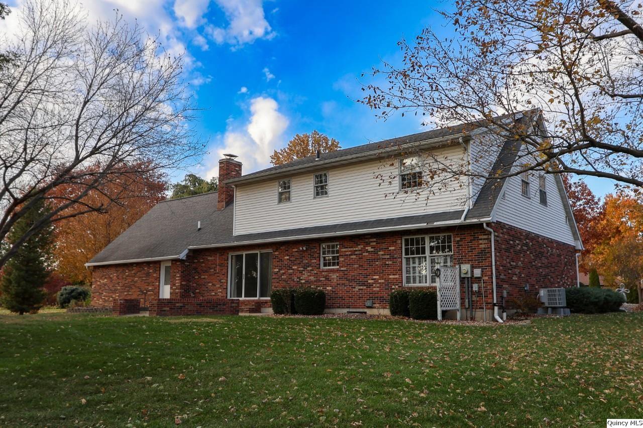 2123 South 30th Street Quincy, IL 62301 - Photo 2 of 36 a front view of a house with a garden