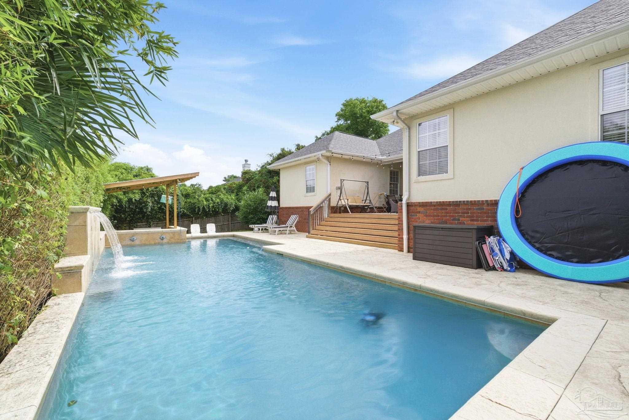 5931 Otter Point Road Pensacola, FL 32504 - Photo 48 of 67 a view of a house with a swimming pool
