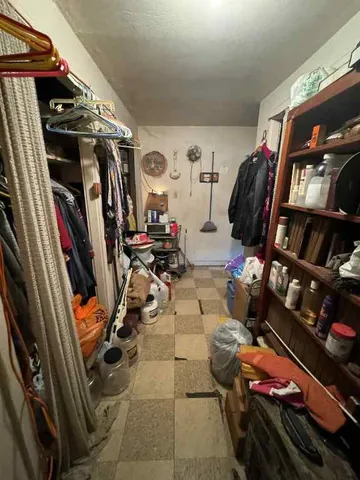 a living room with furniture a window and a fireplace