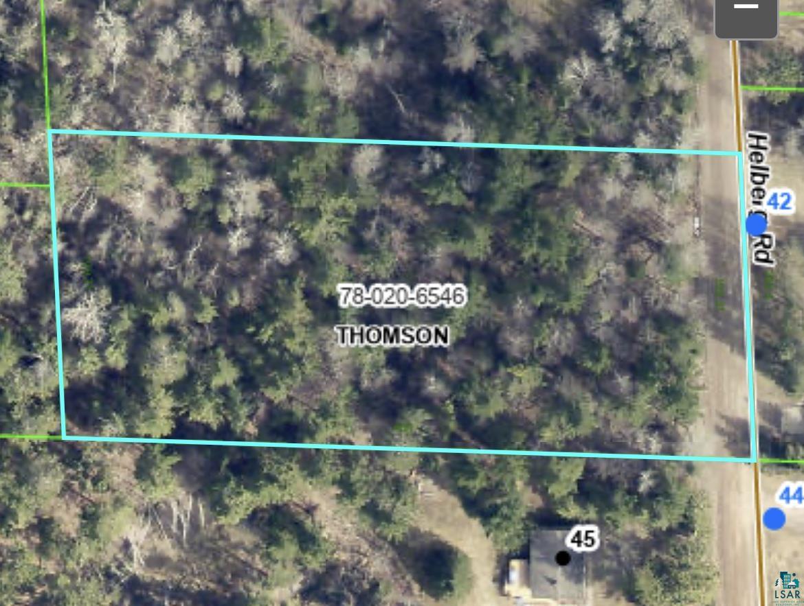 Aerial overview of property's location featuring property parcel outlined